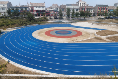 Newly resurfaced blue running track after XJ installation